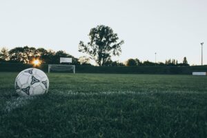 Soccer ball on grass pitch