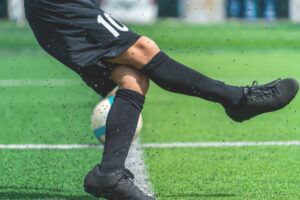 Soccer player completing a pass